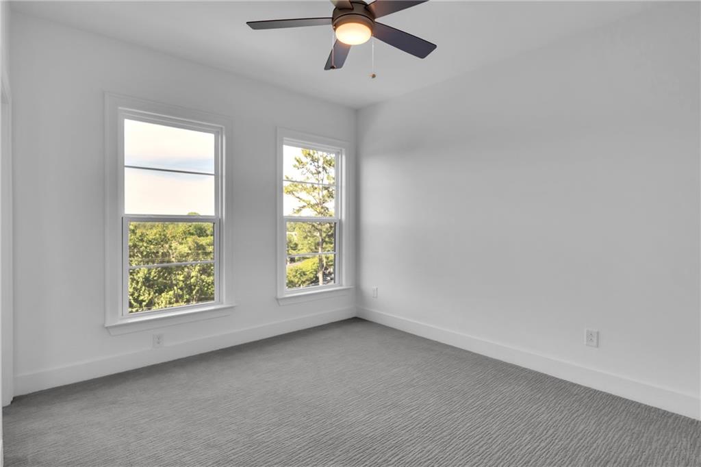 545 Whitlox Road Northwest Atlanta, GA 30309 - Photo 13 of 65 an empty room with a window