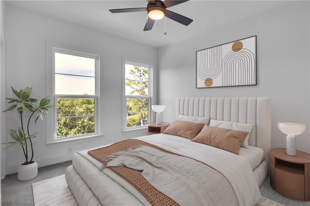 545 Whitlox Road Northwest Atlanta, GA 30309 - Photo 14 of 65 a bedroom with a large bed and a window