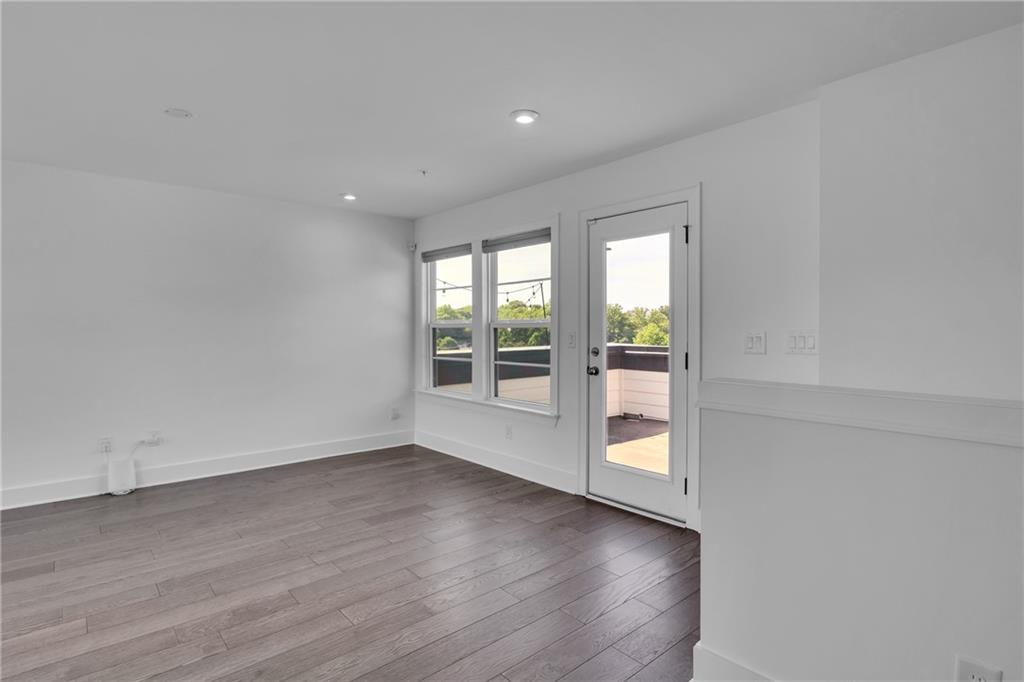 545 Whitlox Road Northwest Atlanta, GA 30309 - Photo 34 of 65 wooden floor in an empty room with a window