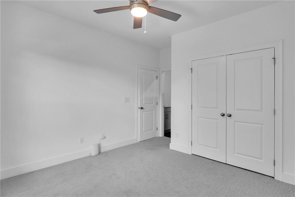 545 Whitlox Road Northwest Atlanta, GA 30309 - Photo 47 of 65 a view of an empty room and chandelier fan