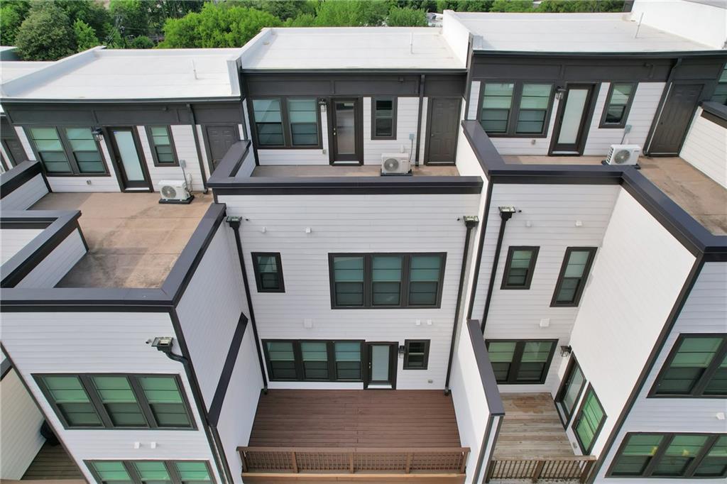 545 Whitlox Road Northwest Atlanta, GA 30309 - Photo 58 of 65 an aerial view of a house with balcony and furniture