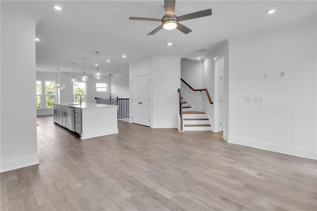 545 Whitlox Road Northwest Atlanta, GA 30309 - Photo 6 of 65 a view of a hallway with stairs and a living room