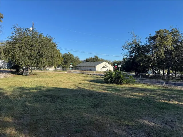 a view of a house with a big yard