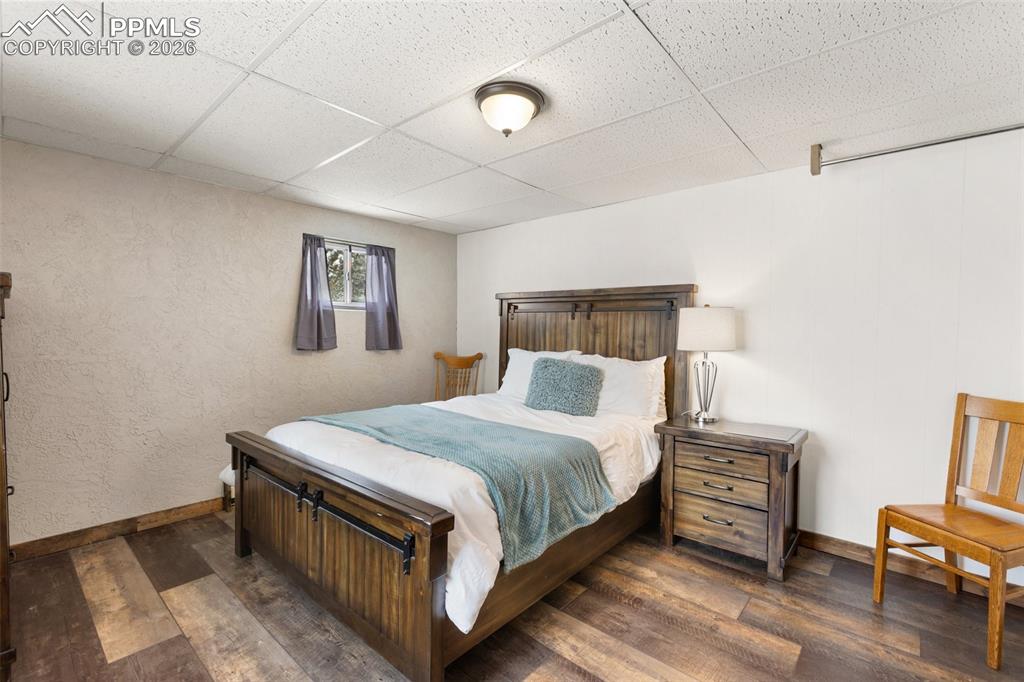 170 Ridge Road Divide, CO 80814 - Photo 28 of 50 a bedroom with a bed and a desk