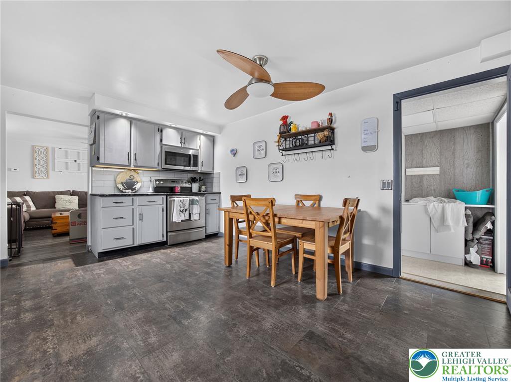 2628 Levans Road Coplay, PA 18037 - Photo 19 of 54 A streamlined kitchen and dining area with modern appliances and durable flooring.