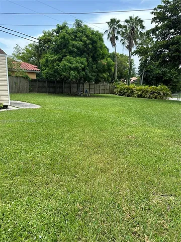a house view with a garden space