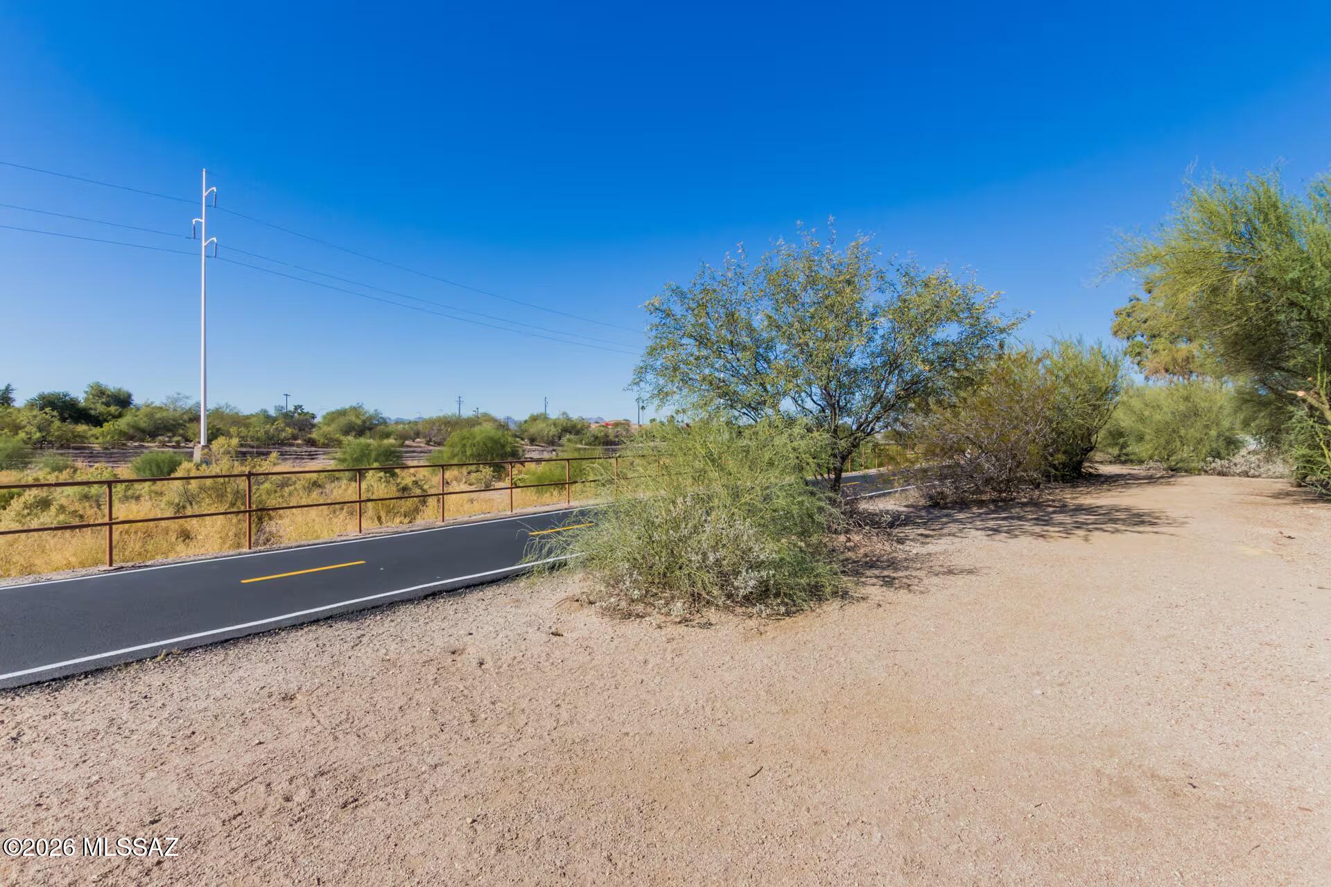 2036 East River Road, Unit 104 Tucson, AZ 85718 - Photo 18 of 23 a view of a yard with an ocean view