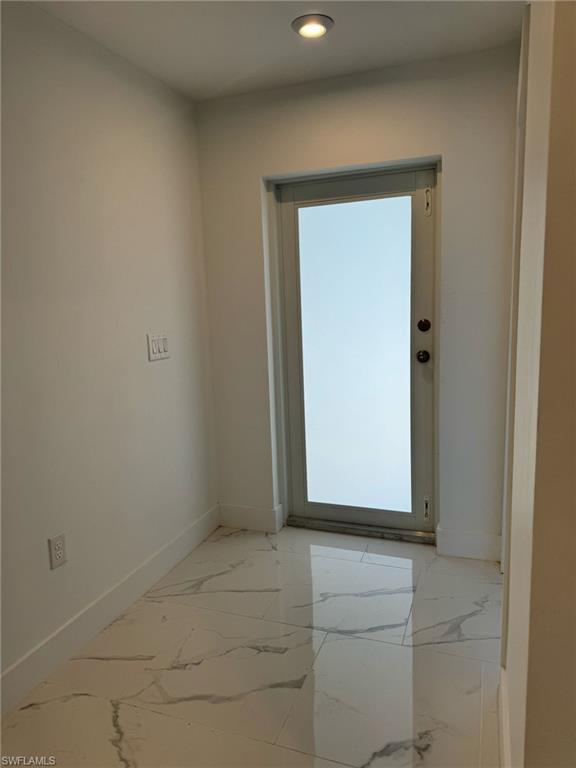 402 Grant Boulevard Lehigh Acres, FL 33974 - Photo 5 of 9 a view of front door