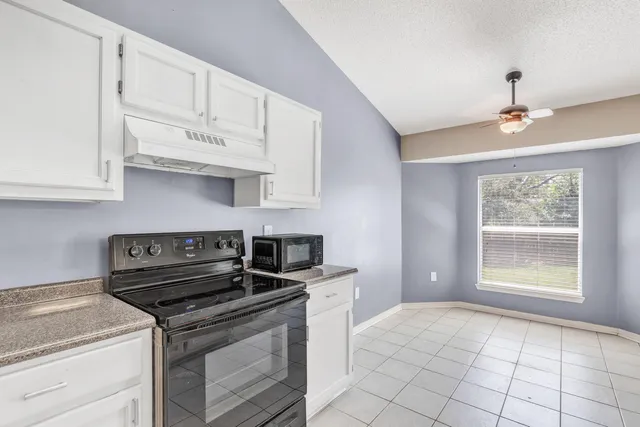 a kitchen with a stove and a sink
