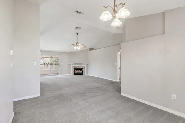 en view interior of a house with a ceiling fan and a chandelier fan