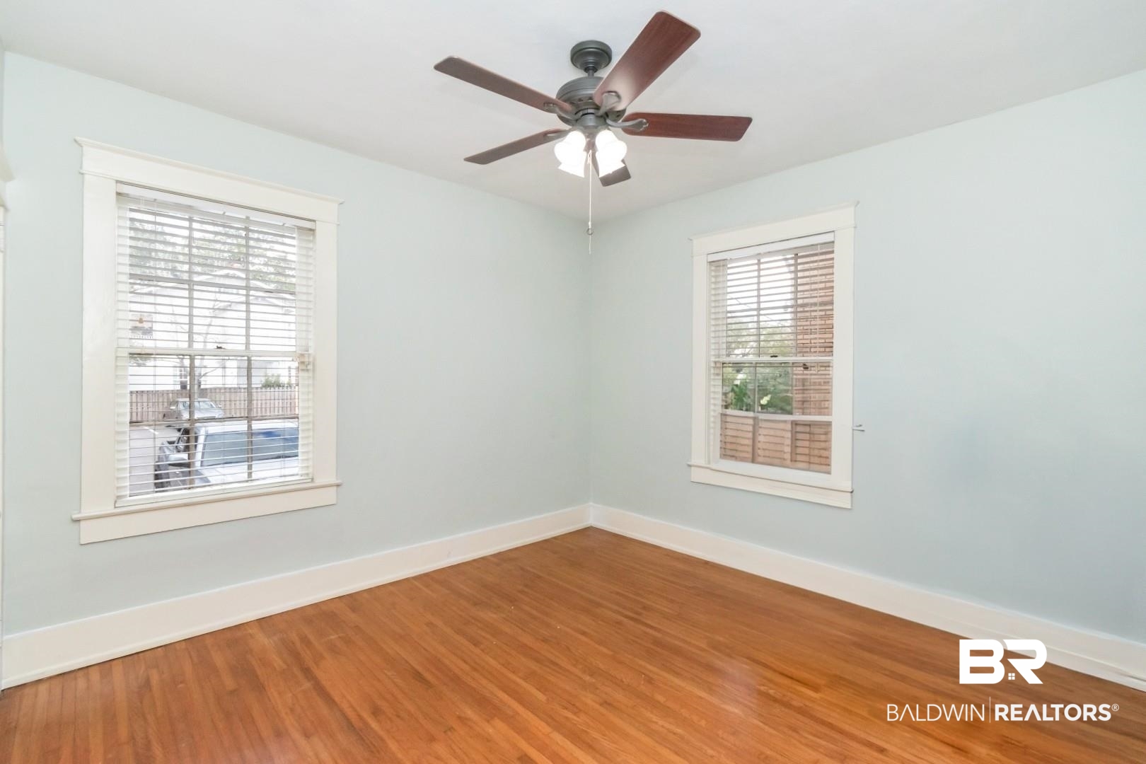 1602 Government Street, Unit 1A Mobile, AL 36604 - Photo 14 of 24 Unfurnished room with wood finished floors and a ceiling fan
