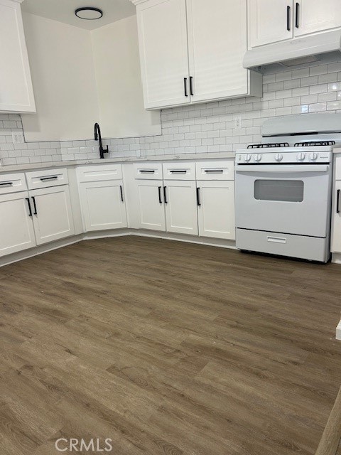 3180 Jane Street Riverside, CA 92506 - Photo 12 of 28 a kitchen with stainless steel appliances granite countertop a stove a sink and white cabinets
