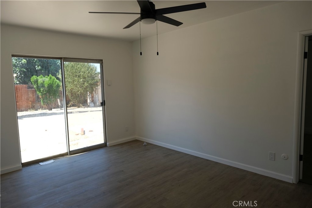 3180 Jane Street Riverside, CA 92506 - Photo 20 of 28 an empty room with wooden floor and windows