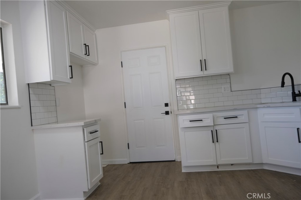 3180 Jane Street Riverside, CA 92506 - Photo 7 of 28 an empty room with white cabinets
