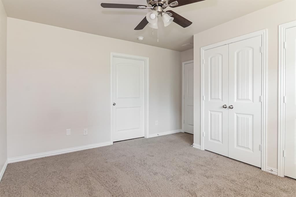 4712 Stokes Street Dallas, TX 75216 - Photo 14 of 16 a view of an empty room and chandelier fan