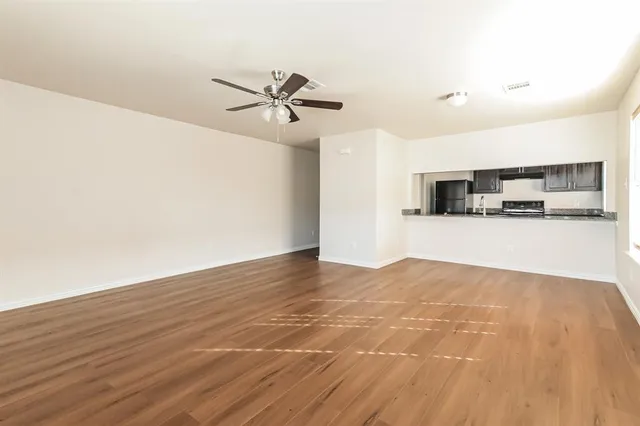 a view of a kitchen with a sink and a microwave