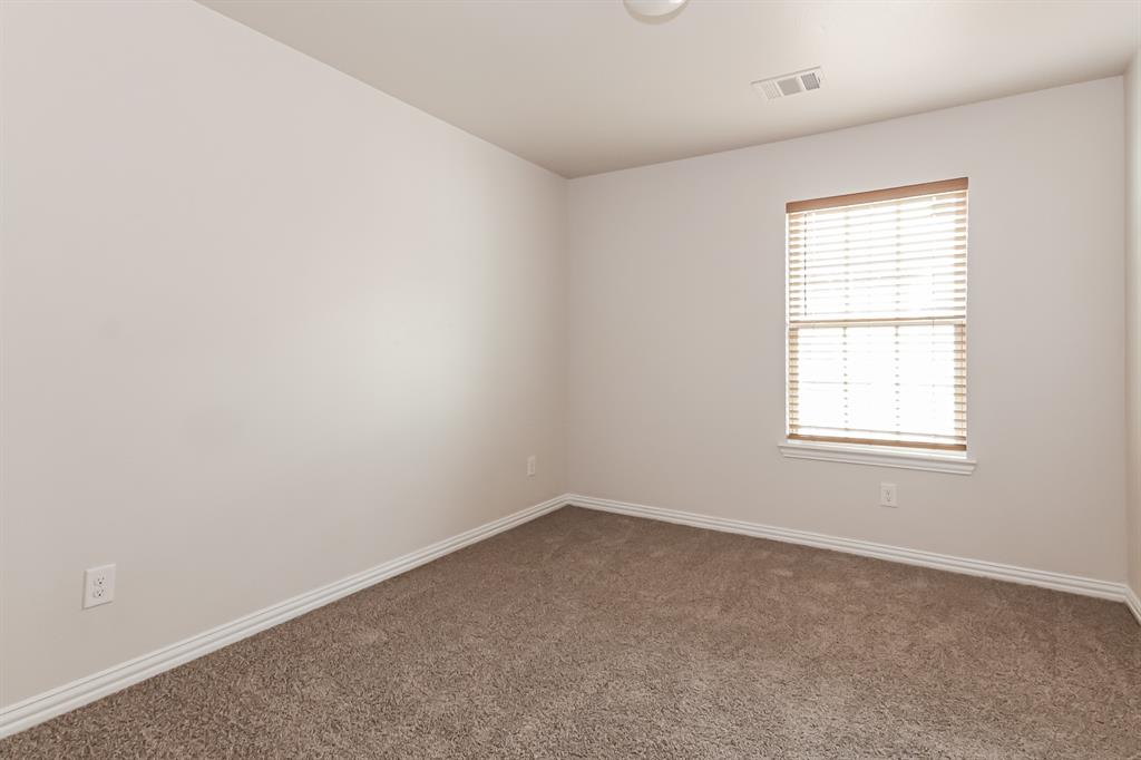 4712 Stokes Street Dallas, TX 75216 - Photo 10 of 16 an empty room with a window