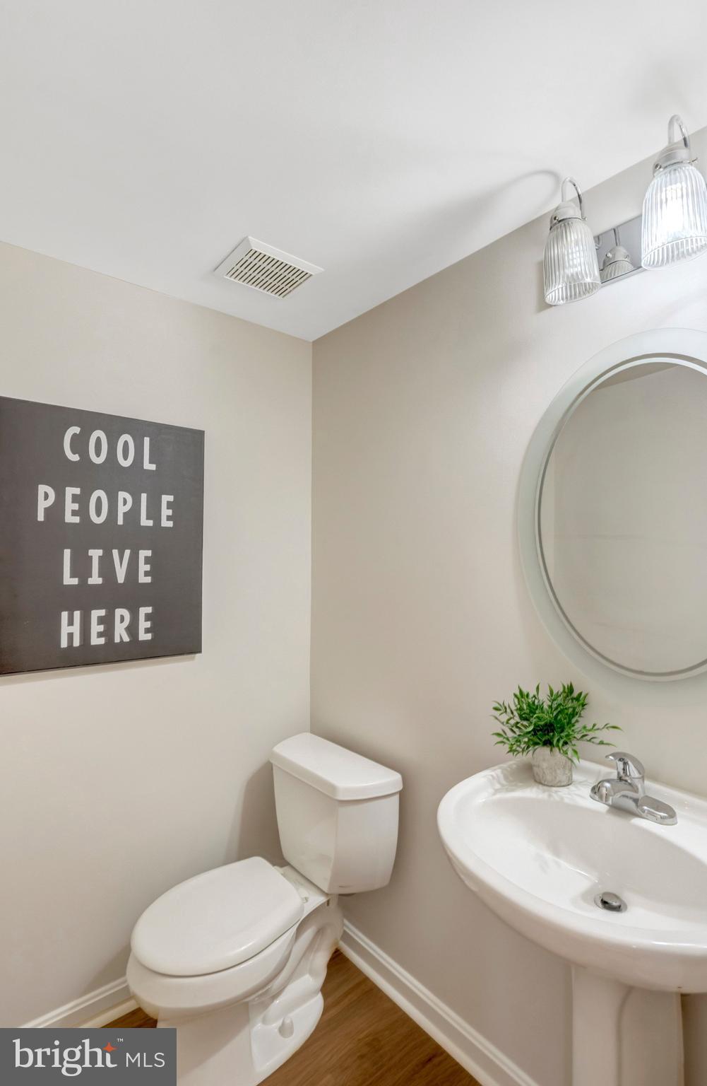 7706 Shadowcreek Terrace Springfield, VA 22153 - Photo 25 of 30 a bathroom with a sink a toilet and mirror