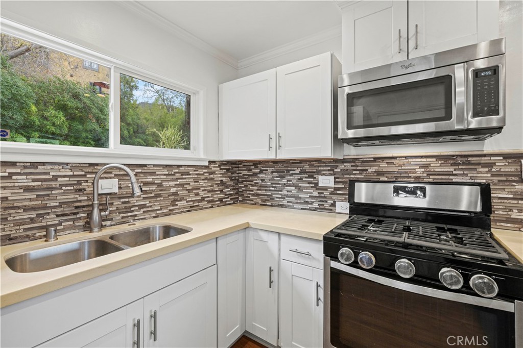65 Grace Terrace Pasadena, CA 91105 - Photo 13 of 39 a kitchen with a stove and a sink