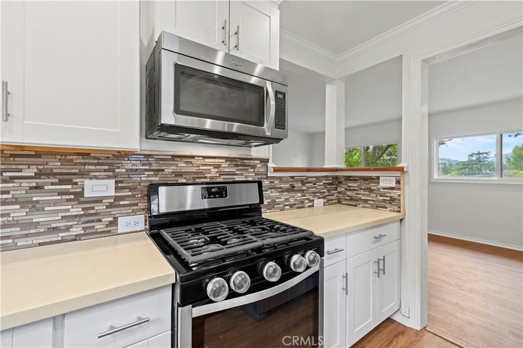 65 Grace Terrace Pasadena, CA 91105 - Photo 14 of 39 a kitchen with a stove and a microwave