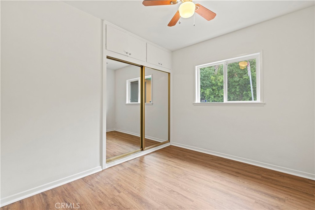 65 Grace Terrace Pasadena, CA 91105 - Photo 17 of 39 an empty room with wooden floor cabinet and windows