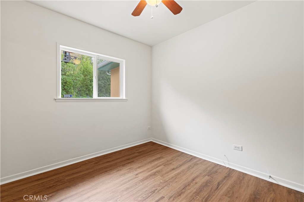 65 Grace Terrace Pasadena, CA 91105 - Photo 18 of 39 an empty room with wooden floor and windows