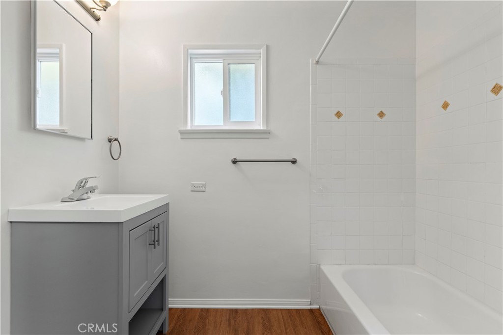 65 Grace Terrace Pasadena, CA 91105 - Photo 19 of 39 a bathroom with a sink a toilet and vanity