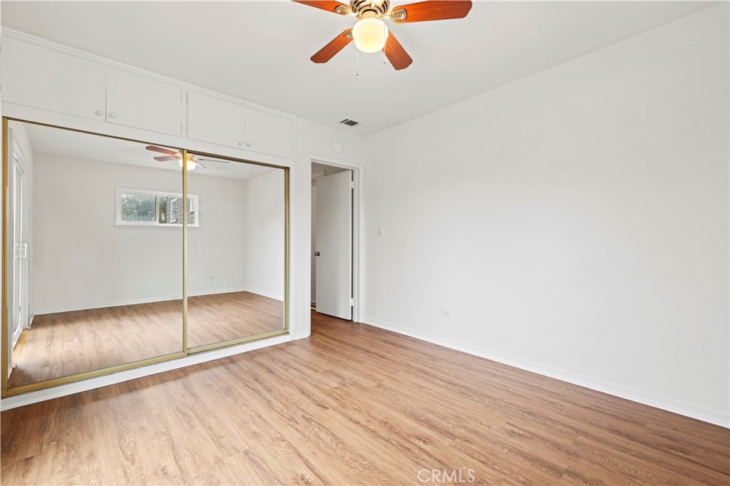 65 Grace Terrace Pasadena, CA 91105 - Photo 26 of 39 a view of an empty room with wooden floor and a ceiling fan