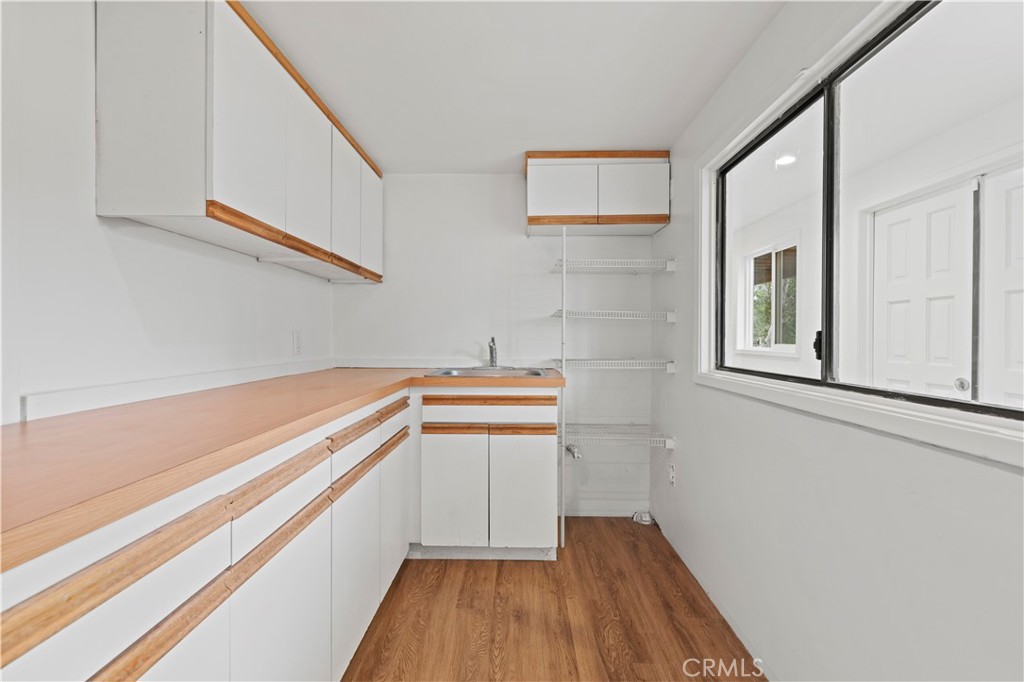 65 Grace Terrace Pasadena, CA 91105 - Photo 29 of 39 a view of a kitchen with wooden floor and a sink