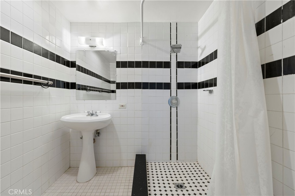 65 Grace Terrace Pasadena, CA 91105 - Photo 34 of 39 a bathroom with a sink a toilet and shower