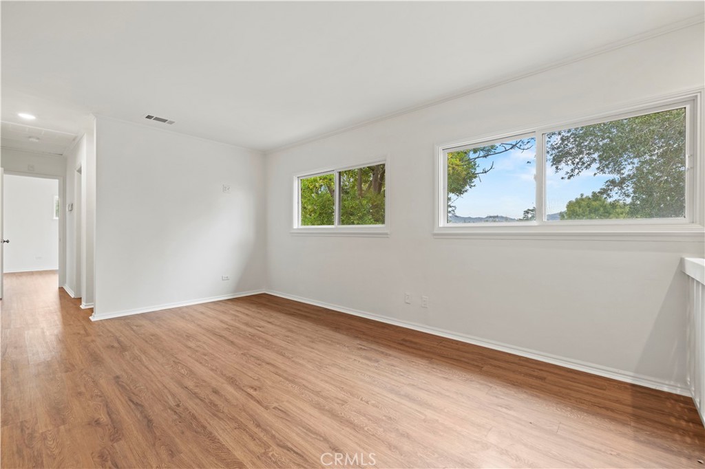 65 Grace Terrace Pasadena, CA 91105 - Photo 7 of 39 a view of empty room with wooden floor and fan