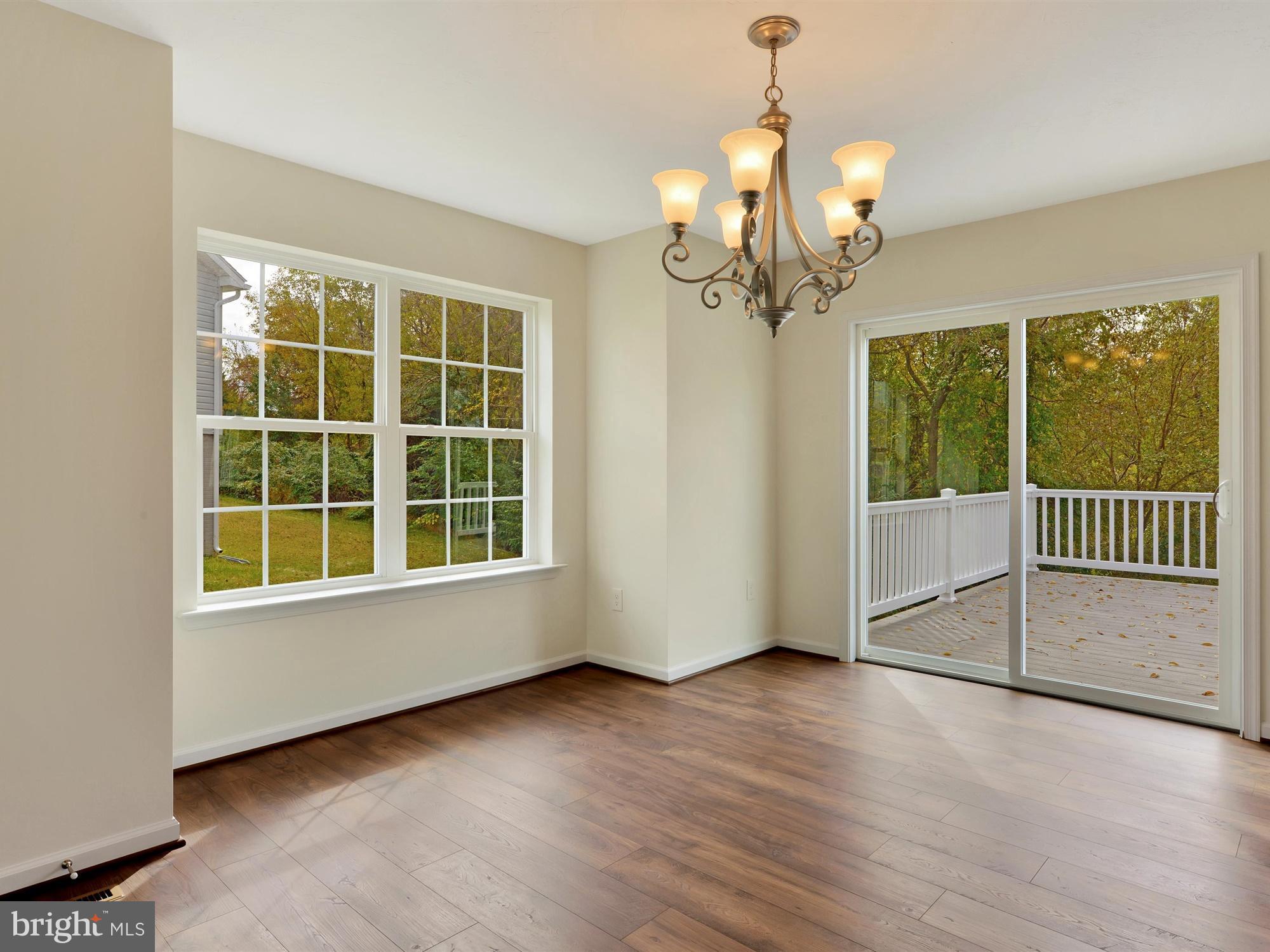 47 Huntmaster Drive Hanover, PA 17331 - Photo 11 of 22 an empty room with wooden floor fan and windows