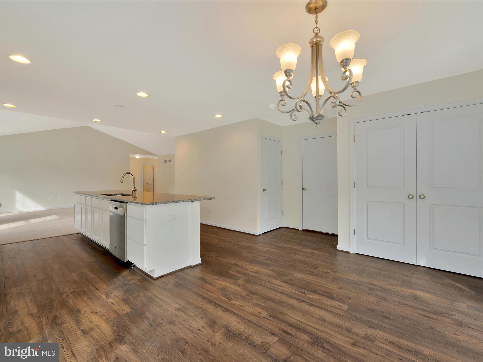 47 Huntmaster Drive Hanover, PA 17331 - Photo 12 of 22 a view of a living room and kitchen with granite countertop wooden floor