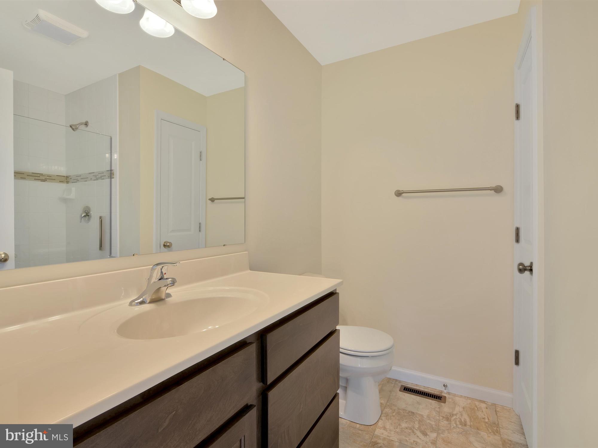 47 Huntmaster Drive Hanover, PA 17331 - Photo 16 of 22 a bathroom with a sink a toilet and shower