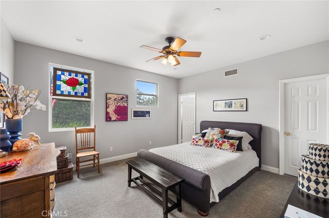 a bedroom with a bed and a table in it