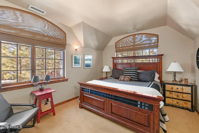 a bathroom with a tub a sink and glass door