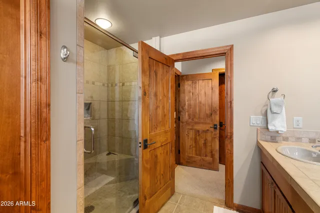 a bedroom with furniture and a window