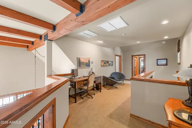 a bathroom with a granite countertop shower a sink and a mirror