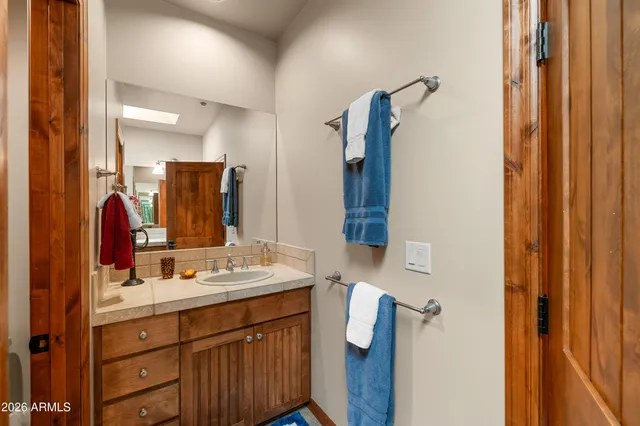 a view of a chairs and table in the balcony