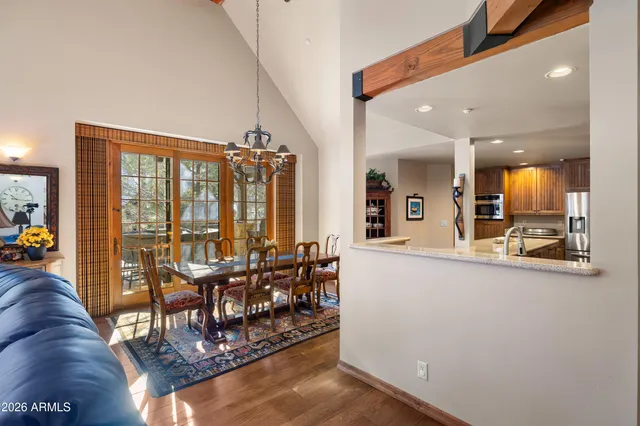 a kitchen with a stove a refrigerator and a sink
