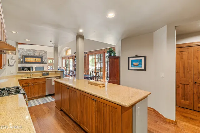 a kitchen with stainless steel appliances granite countertop a sink counter space cabinets and furniture