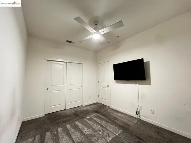 a view of a livingroom with a flat screen tv