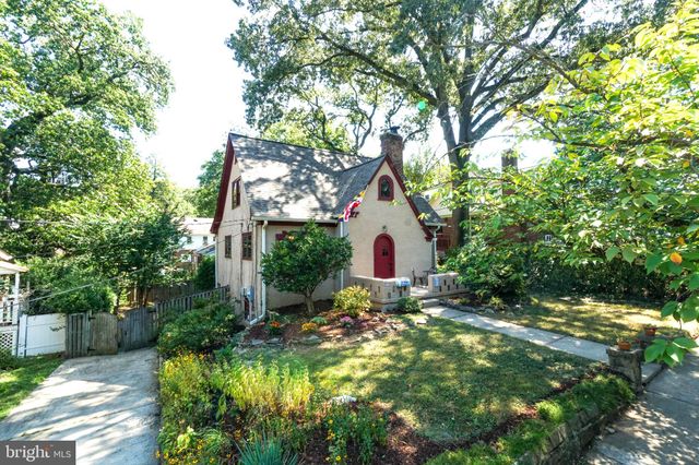 a view of backyard of house with green space