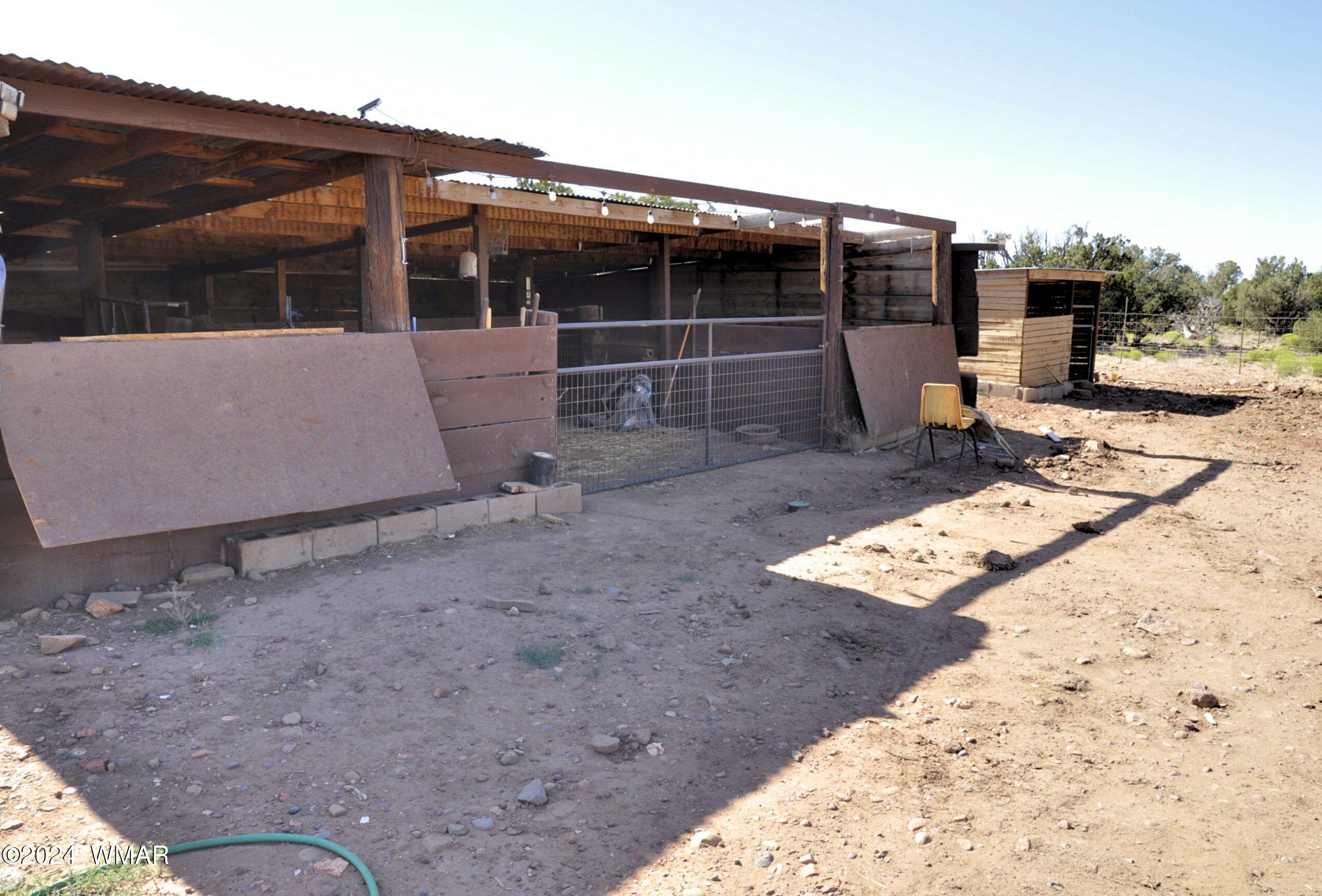 20 N8564 Concho, AZ 85924 - Photo 19 of 28 a backyard of a house with barbeque oven table and chairs