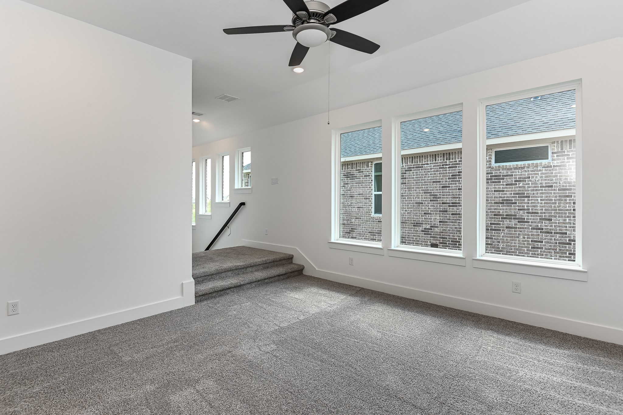 4847 Morning Spgs Drive Spring, TX 77386 - Photo 12 of 21 an empty room with windows and fan