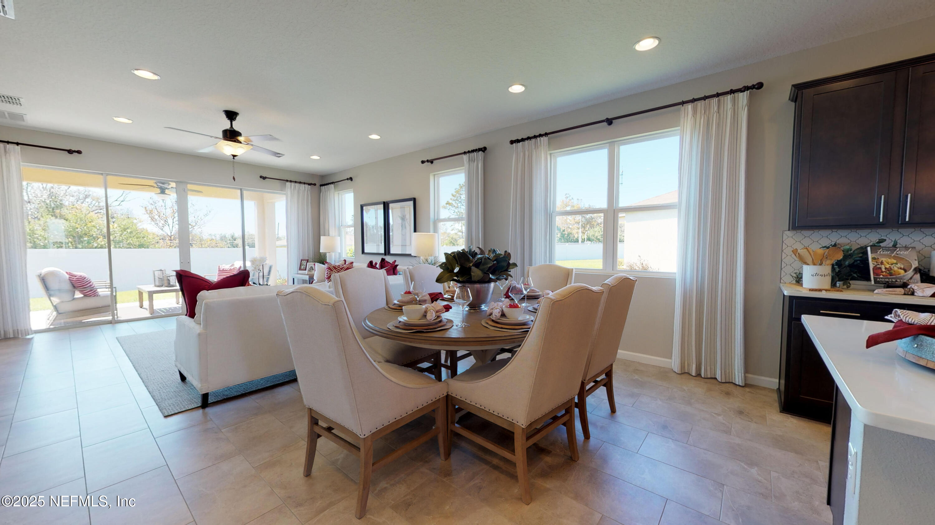 324 Alexandrite Street DeLand, FL 32720 - Photo 7 of 17 a dining room with furniture a window and wooden floor