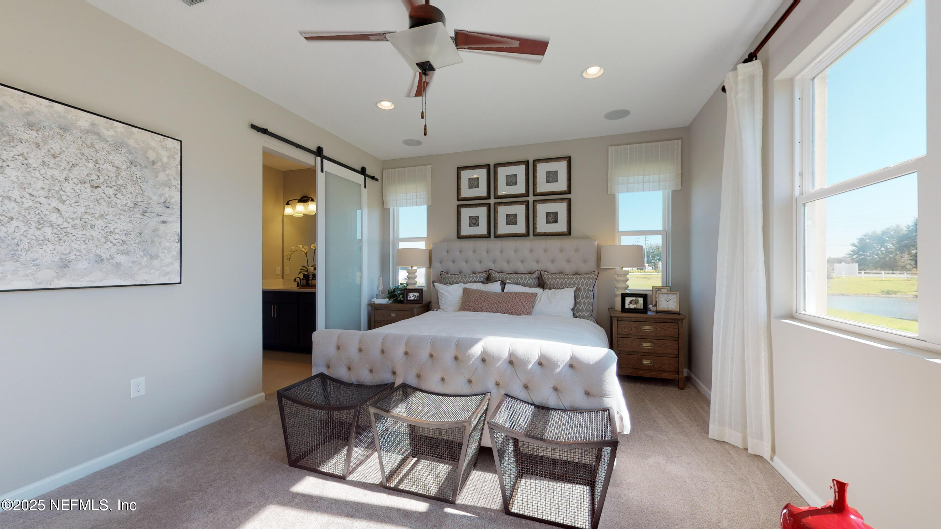 324 Alexandrite Street DeLand, FL 32720 - Photo 10 of 17 a bedroom with a bed and a chandelier