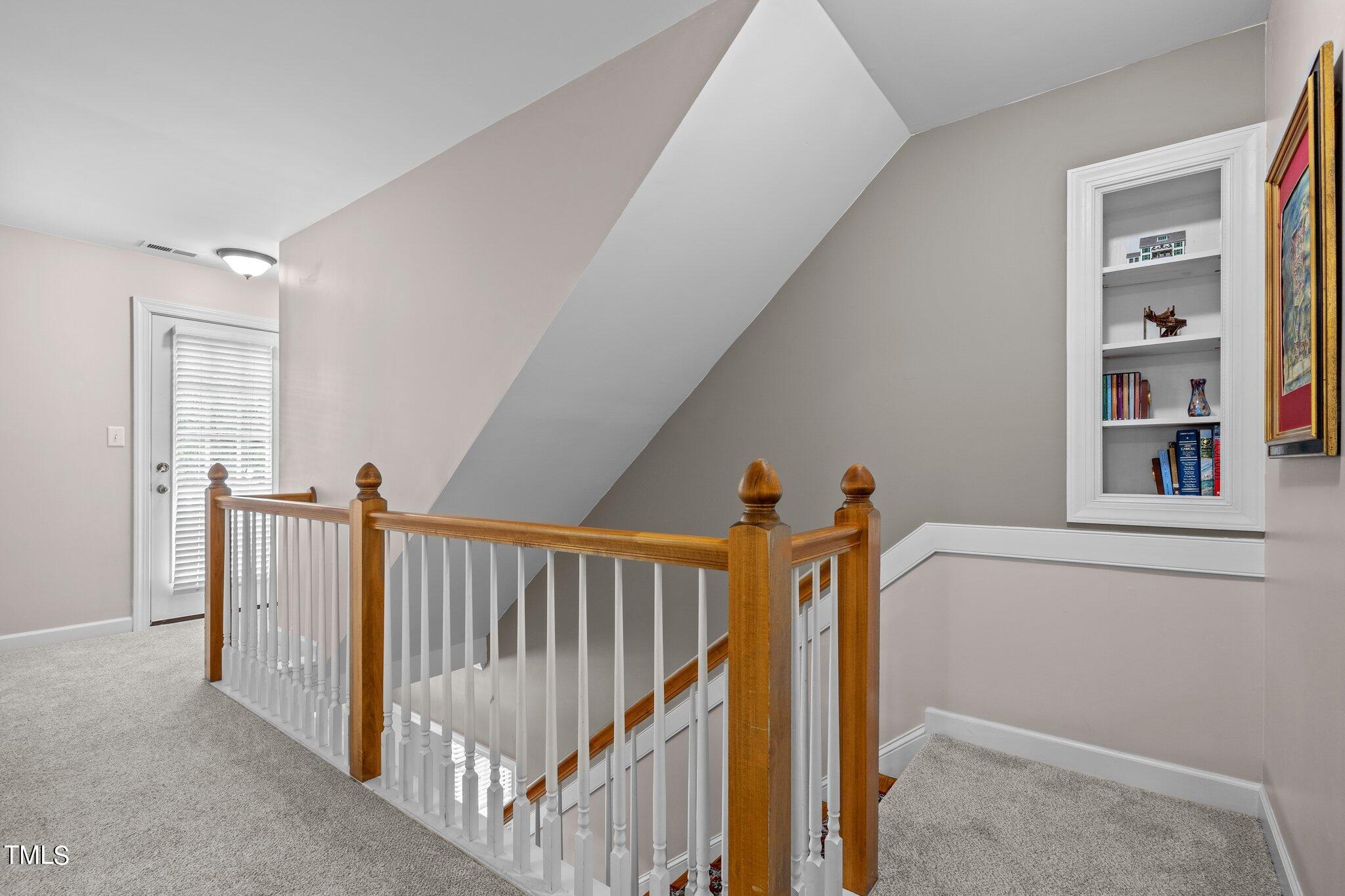 100 Shepton Drive Cary, NC 27519 - Photo 14 of 43 a view of hallway with stairs and a window