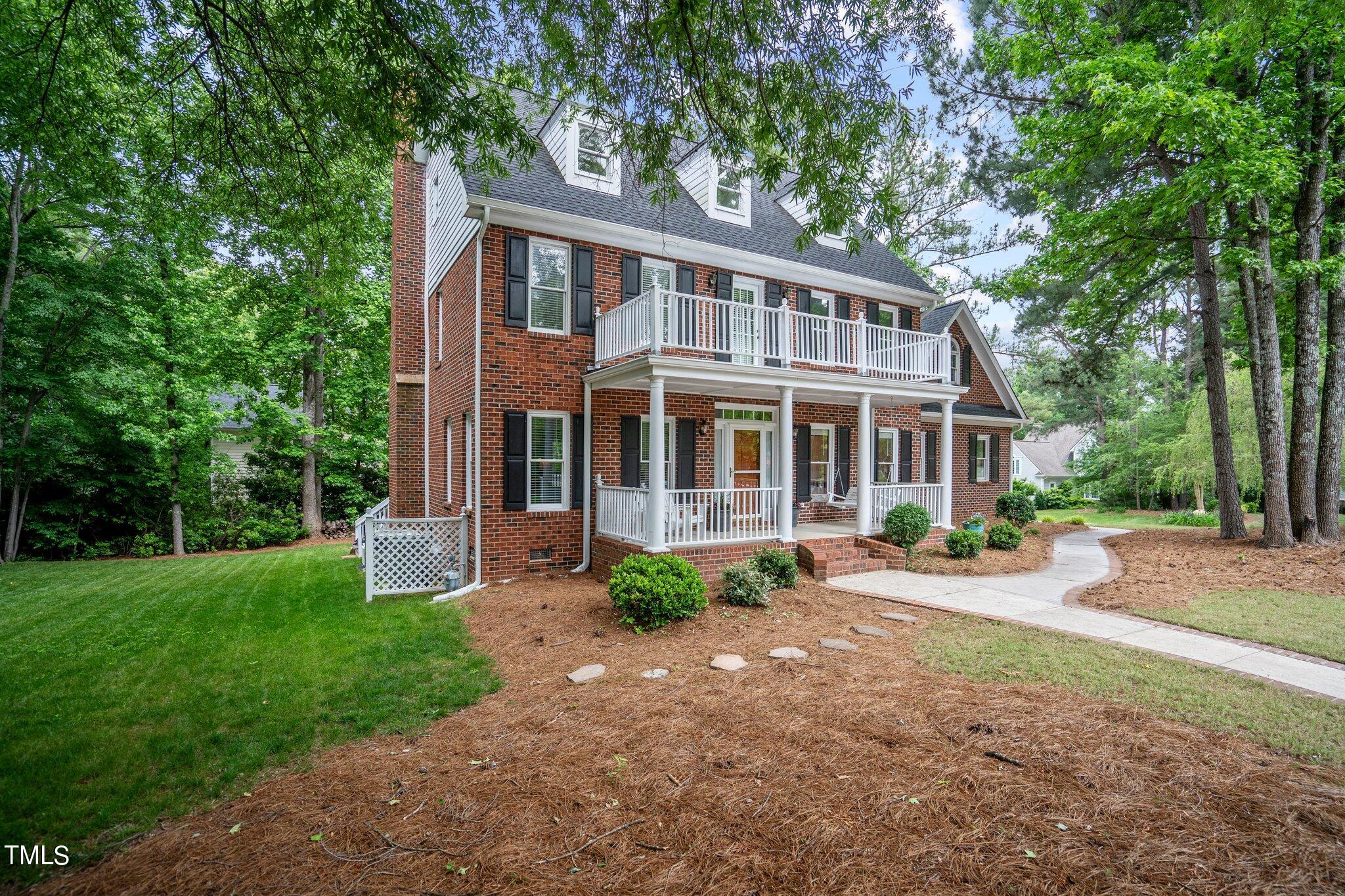 100 Shepton Drive Cary, NC 27519 - Photo 3 of 43 a front view of a house with yard and green space