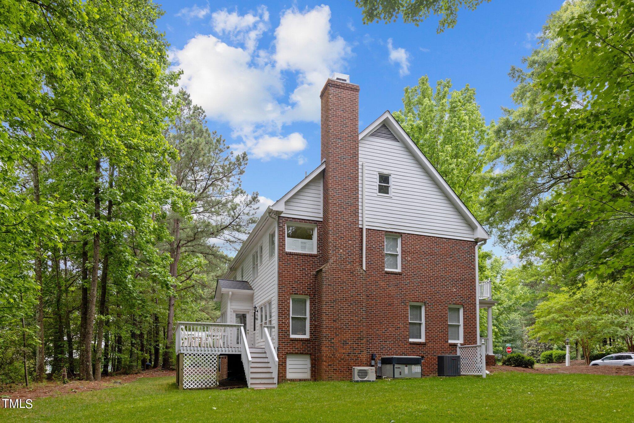 100 Shepton Drive Cary, NC 27519 - Photo 31 of 43 a view of a house with backyard